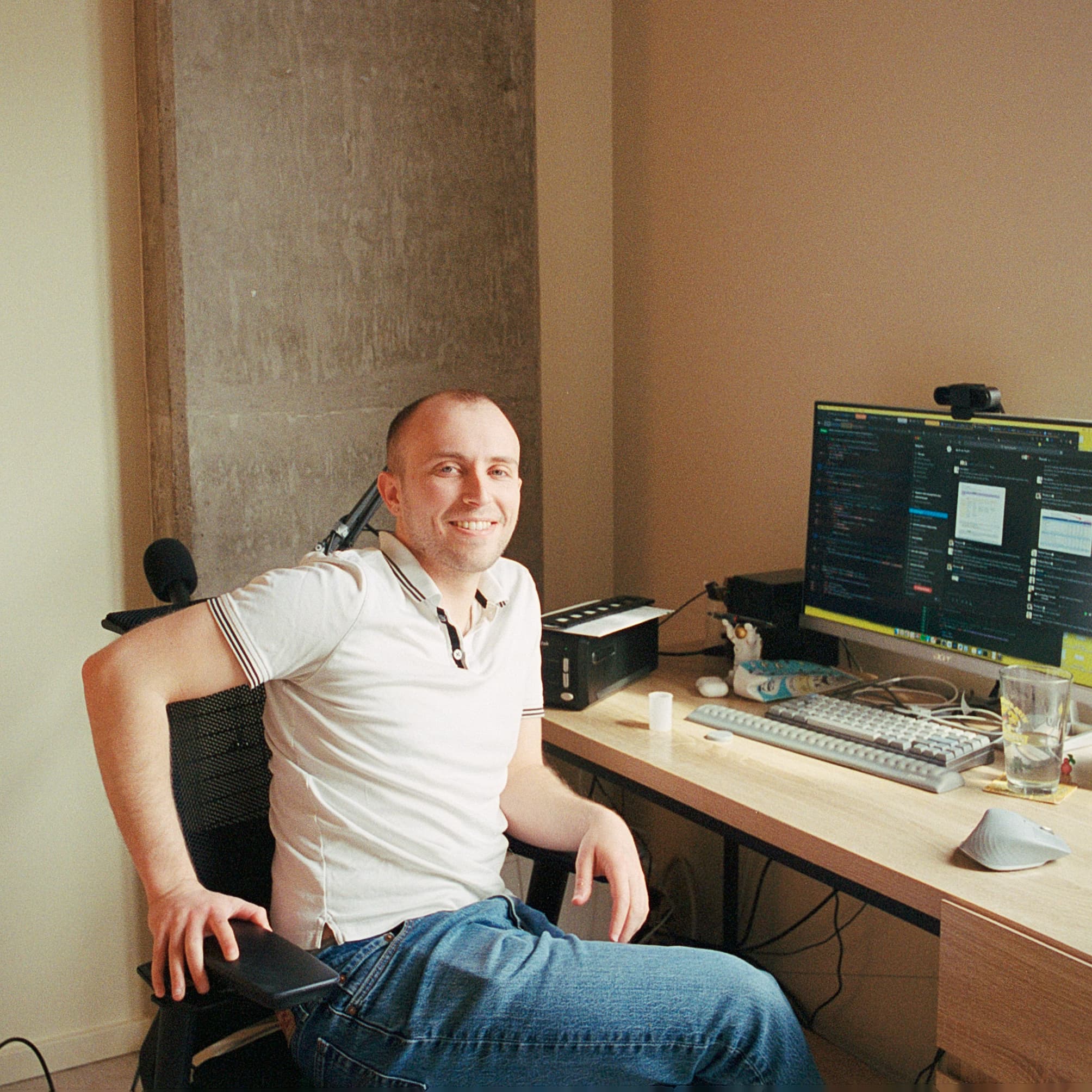 Nate Baum sitting at his desk in front of his computer